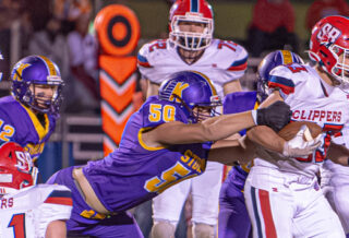 Kewaunee lineman Matthew Boeder locks on to Sturgeon Bay’s Craven Lautenbach late in the Storm’s week seven blowout win against the Clippers.
