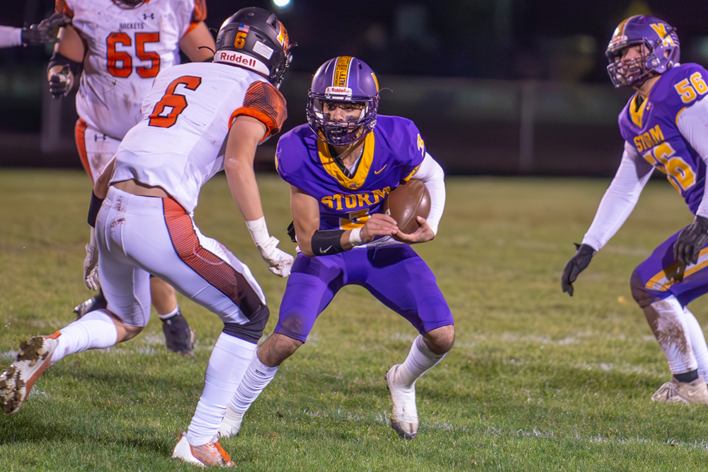 Kewaunee quarterback Thomas Stangel on one of his three carries Friday as the Storm defeated the Rockets in Round 2. Josh Staloch photo