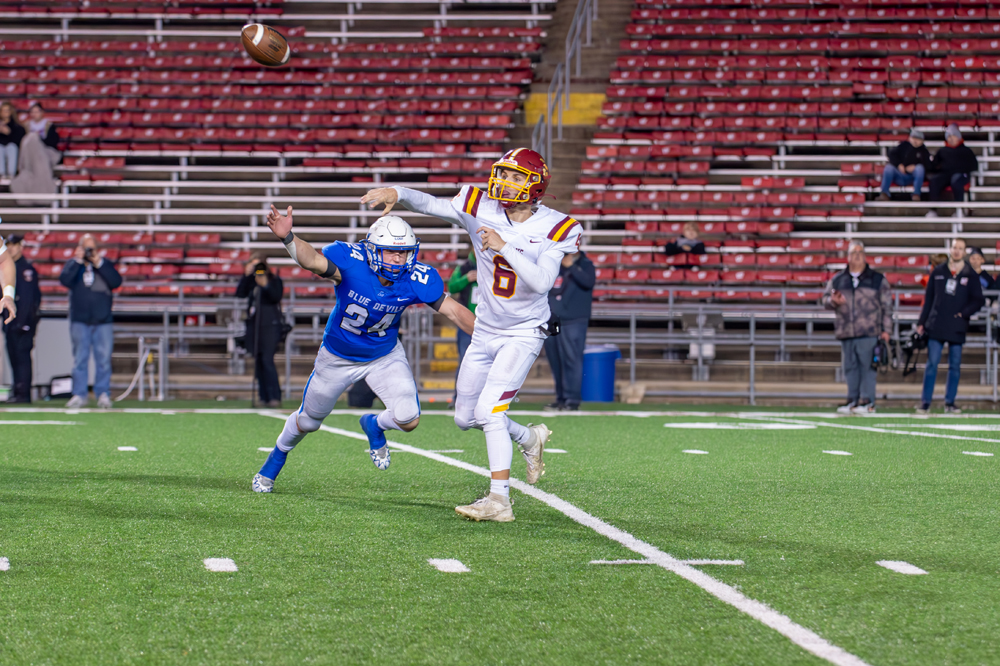 L-C quarterback Max Ronsman fires a pass downfield to Trace Schoenebeck to set up the teams first score on Thursday as they took on Lodi in the State Championship game.