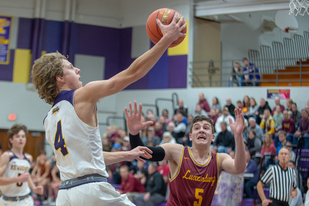 Avery Jerabek drives towards the basket with Luxemburg-Casco's Reagan Doell closing in Tuesday in Kewaunee. Josh Staloch photo