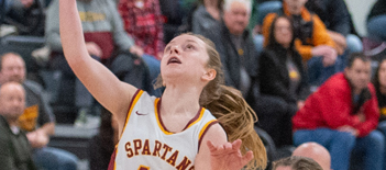 Nora Krause was all over the court for Algoma on Monday. Here, she scores on a drive to the basket with a defender keeping stride. Josh Staloch photo