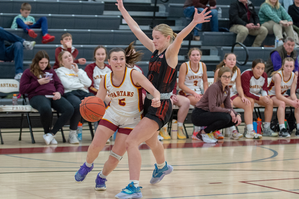Luxemburg-Casco's Brianna Bray gets around a Mishicot defender along the baseline